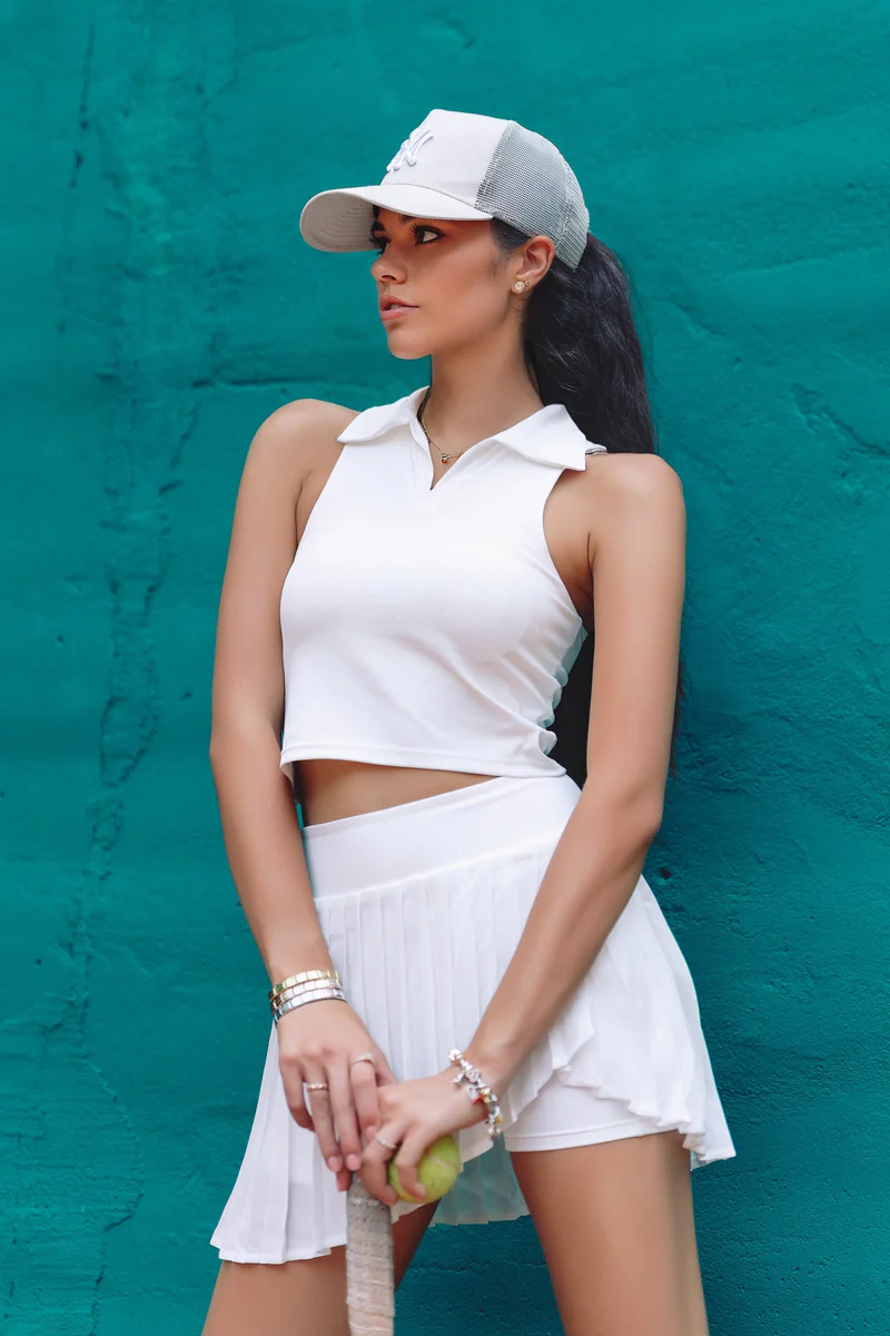Maison and Aurora model wearing white skirt and top